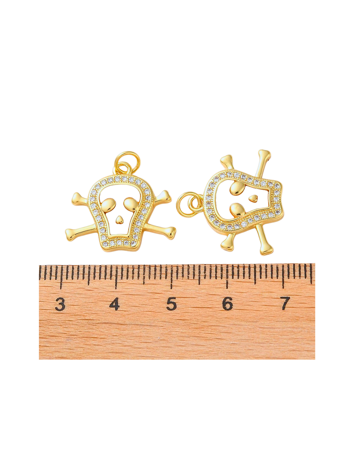 Front & side of Gold and Pearlescent Embellished Skull next to a ruler