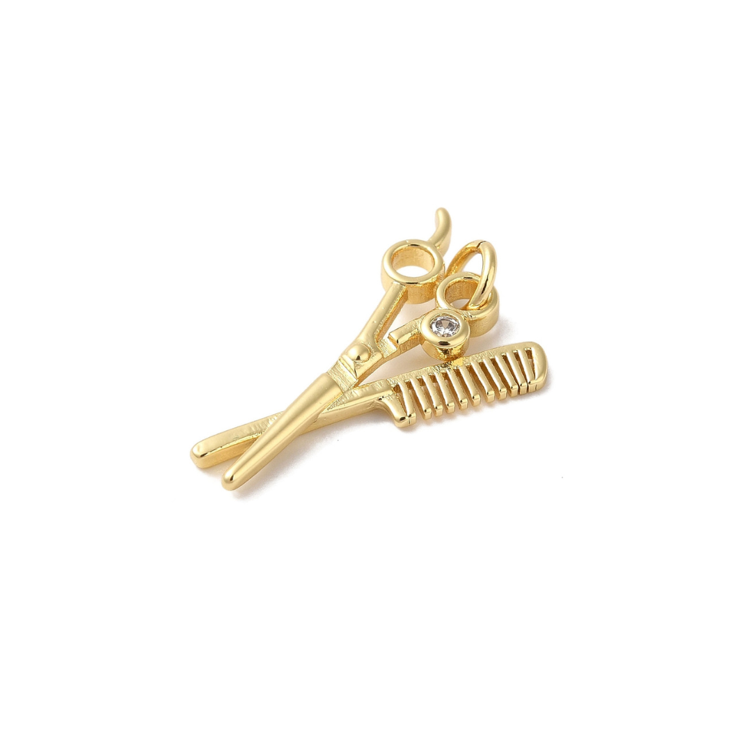 Side view of the Gold Scissors & Comb Duo Charm