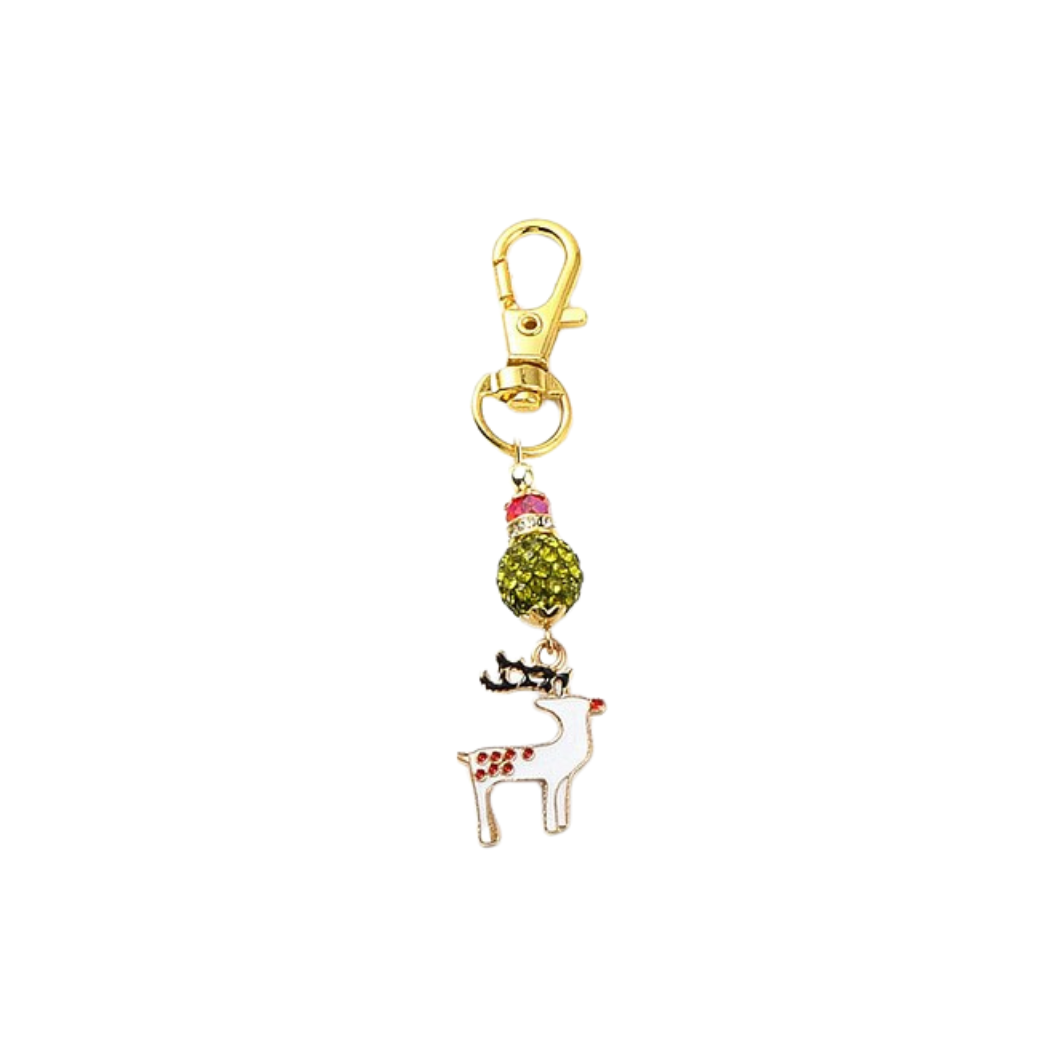 Keychain with reindeer charm and green bead on a white background