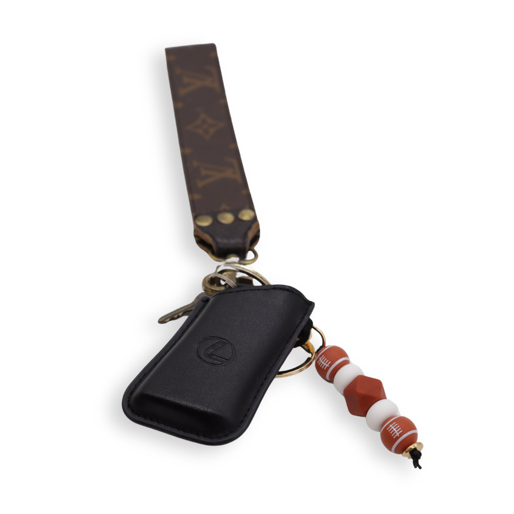 Brown & White Football Keychain on a set of keys