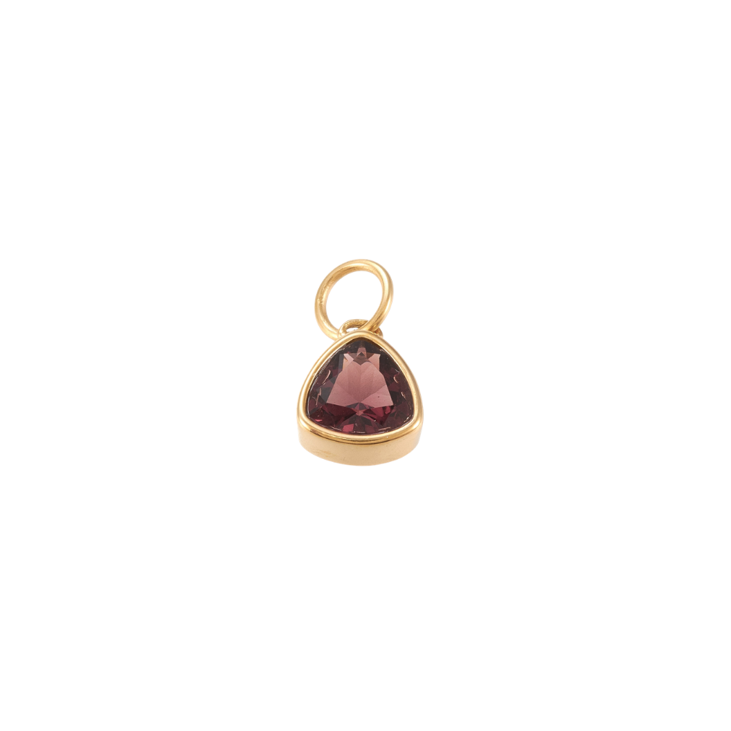 Gold triangular charm featuring a faceted deep burgundy gemstone on a transparent background.
