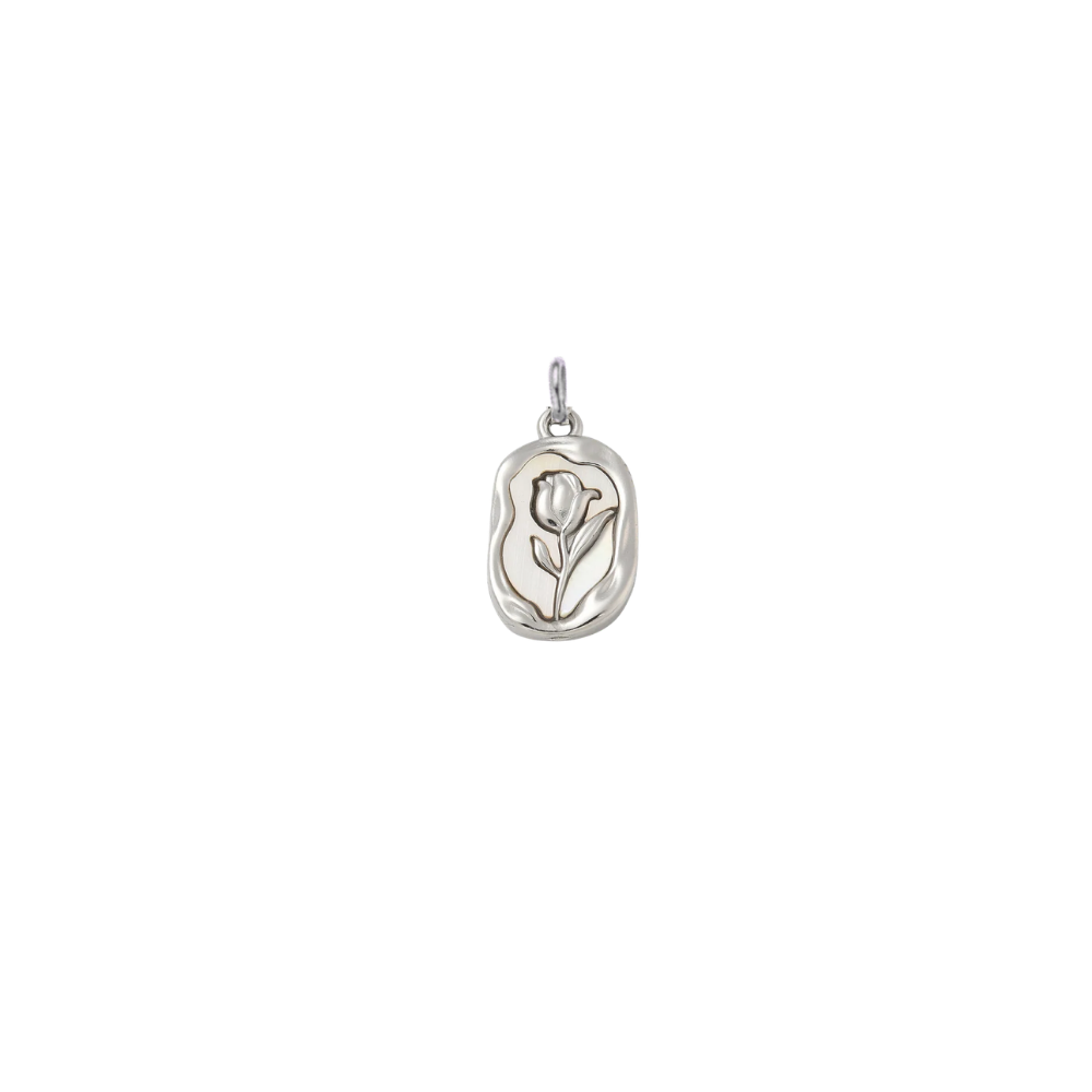 Silver embossed vintage rose charm featuring a raised floral design on an organic rectangular pendant, displayed on a transparent background.