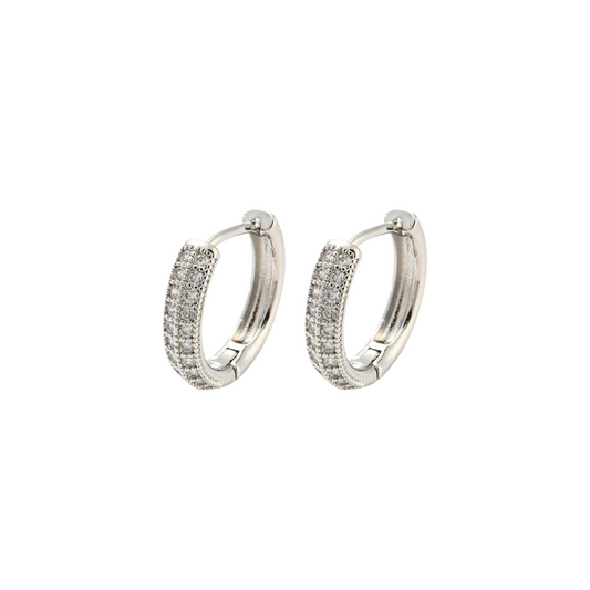 Pair of silver hoop earrings on a white background