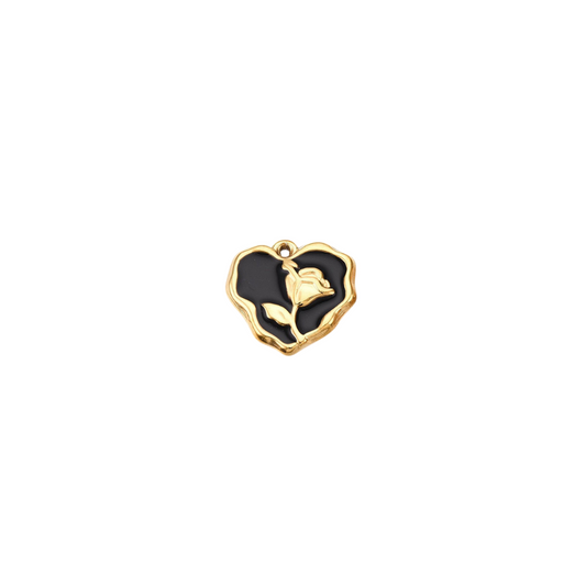 Heart-shaped pendant with a rose design on a white background