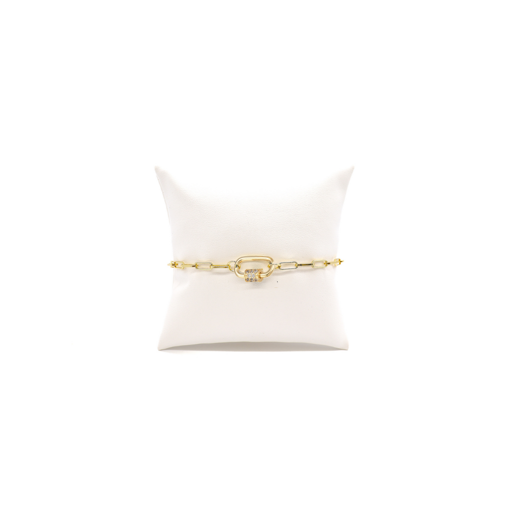 Ashley thick paperclip chain bracelet on white cushion with small gabi.