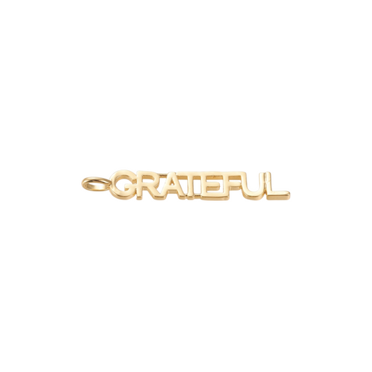 Front view of the Gold Grateful Bar Charm