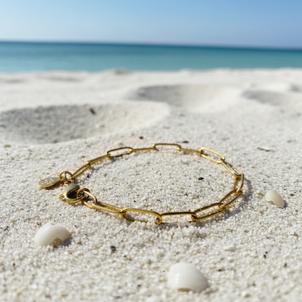 Gold Storyline Bracelet on sand 
