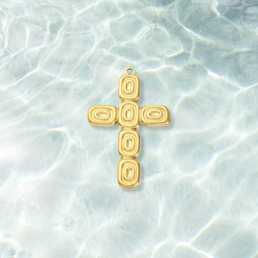 Gold Abstract Cross Charm  on water background 