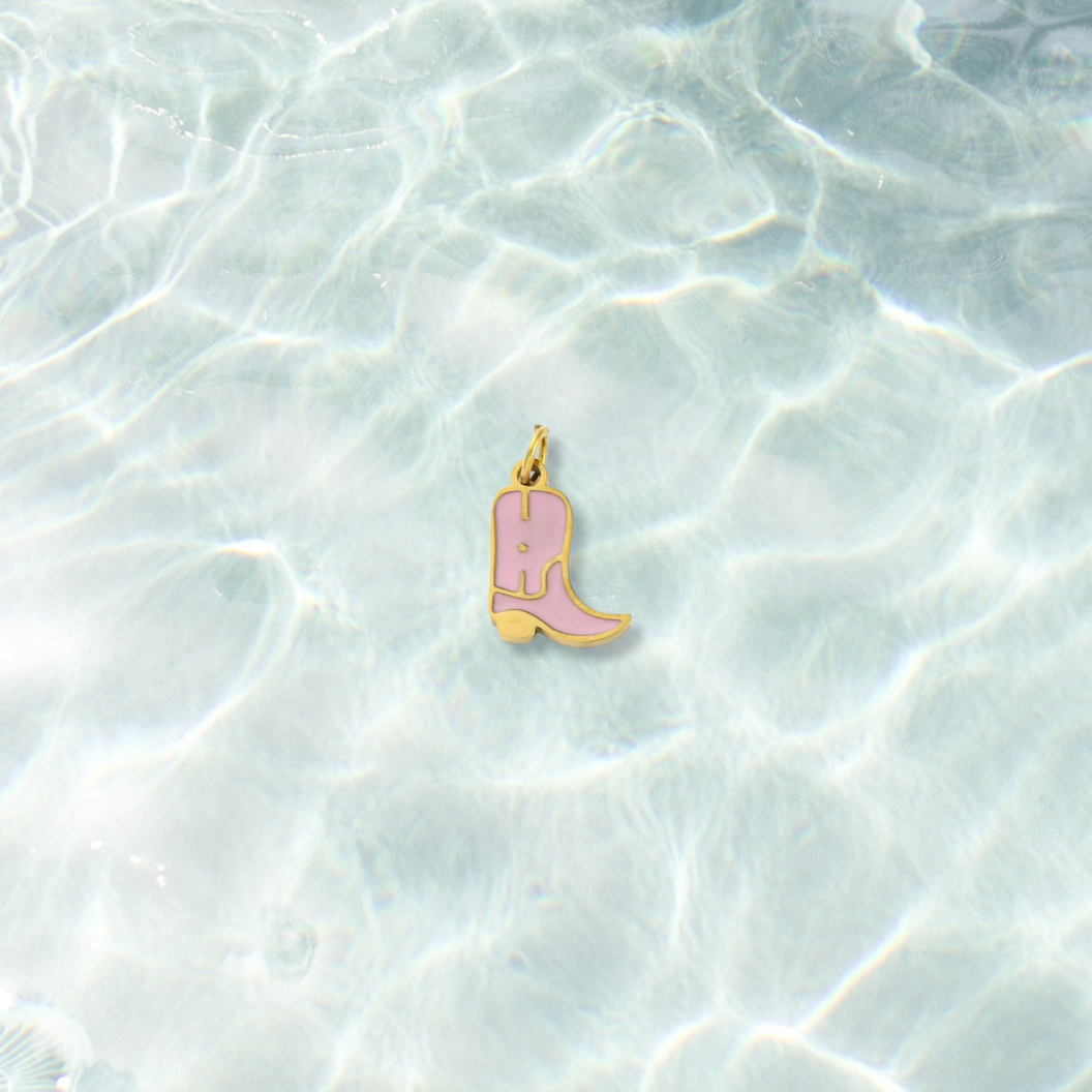 Gold Rose Cowboy Boot Charm on water background 