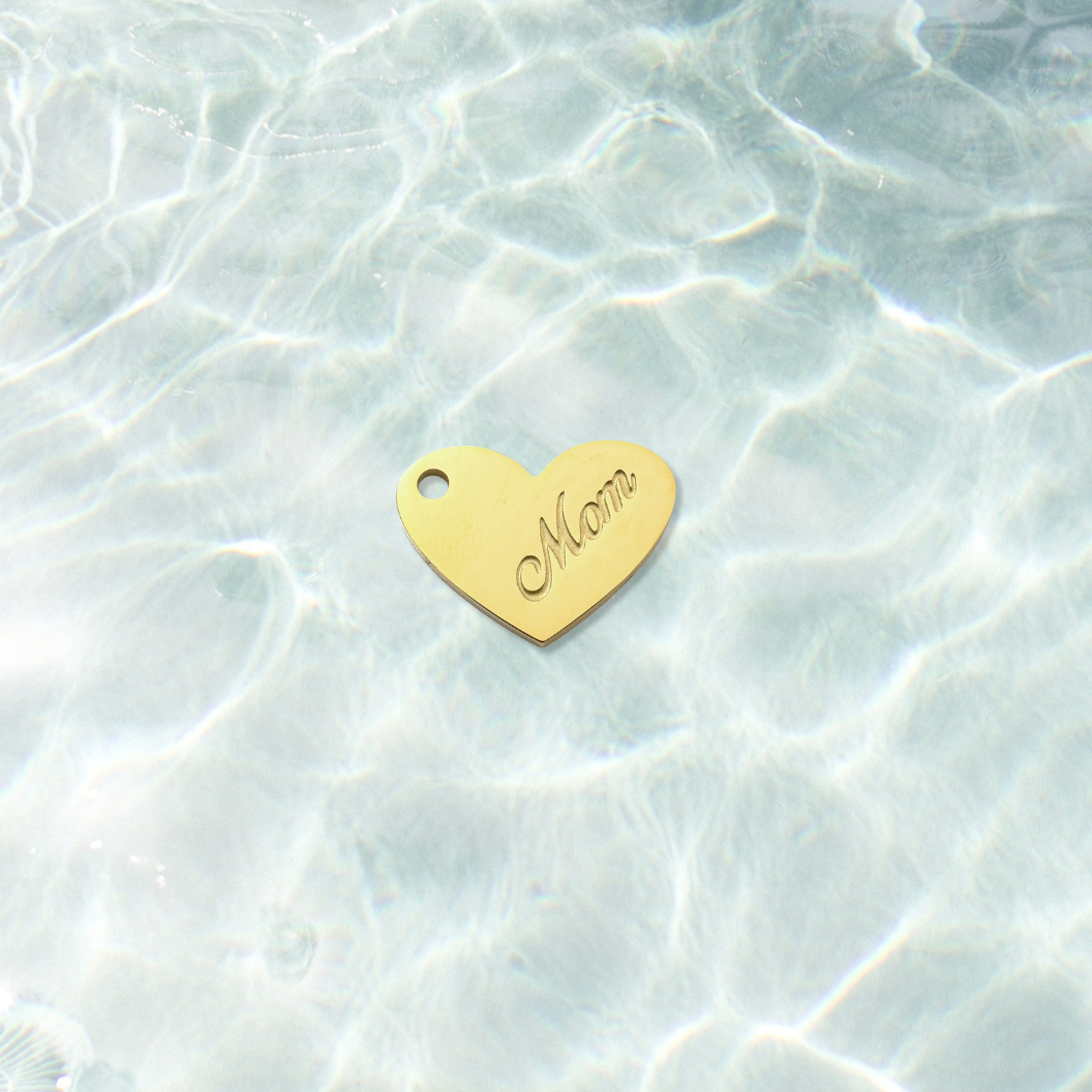 Gold Classic Mom Keepsake Heart Charm on water background 