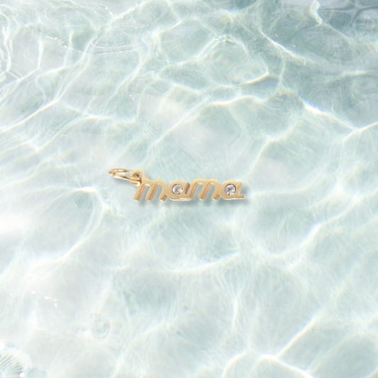 Gold Crystal Accent Mama Charm on water background