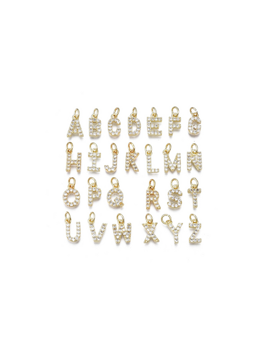 Pave initial charms A-Z on white background in 4 rows, front view.