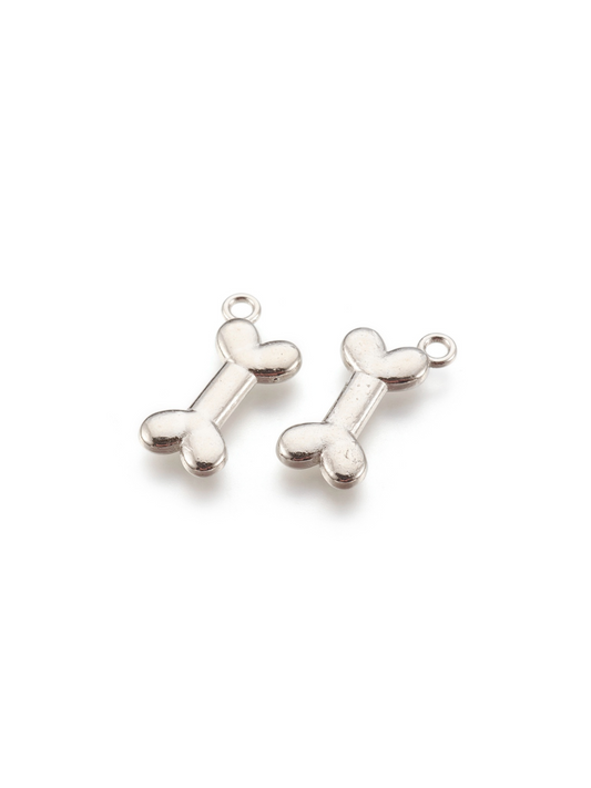 Two Dog Bone Charms side by side, front view.