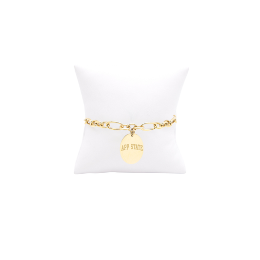 Appalachian State University gold large link Keepsake bracelet with large oval charm with app state text on white pillow front view
