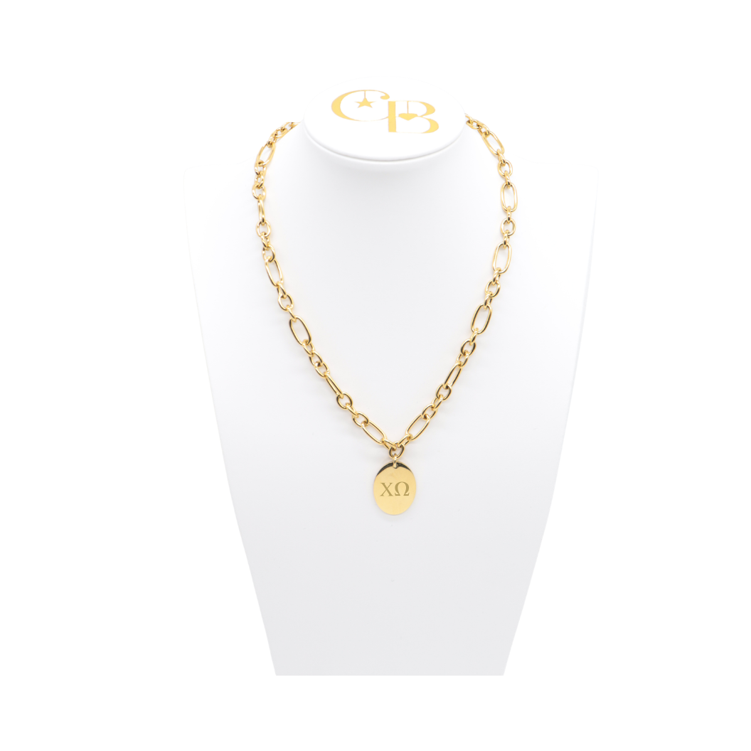Chi Omega gold large link Keepsake Necklace with large oval charm with horizontal greek letters on white bust front view
