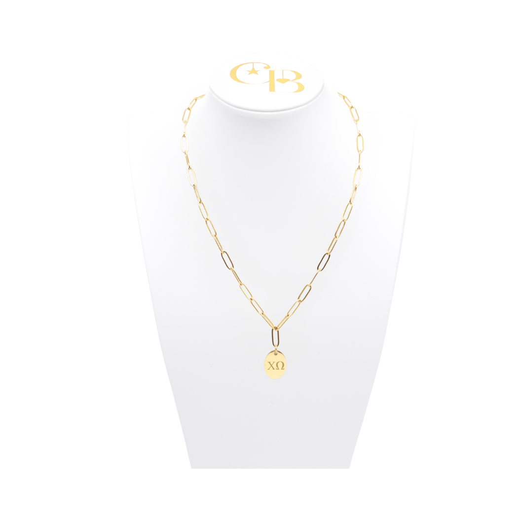Chi Omega gold link storyline necklace with small oval charm with horizontal greek letters on white bust front view