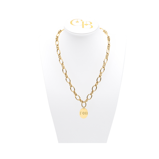 Gamma Phi Beta gold large link evermore necklace with large oval charm displayed on white necklace bust front view with vertical/stacked greek letters