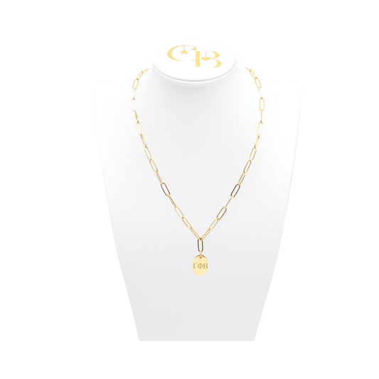 Gamma Phi Beta gold link storyline necklace with small oval charm displayed on white necklace bust front view with horizontal greek letters