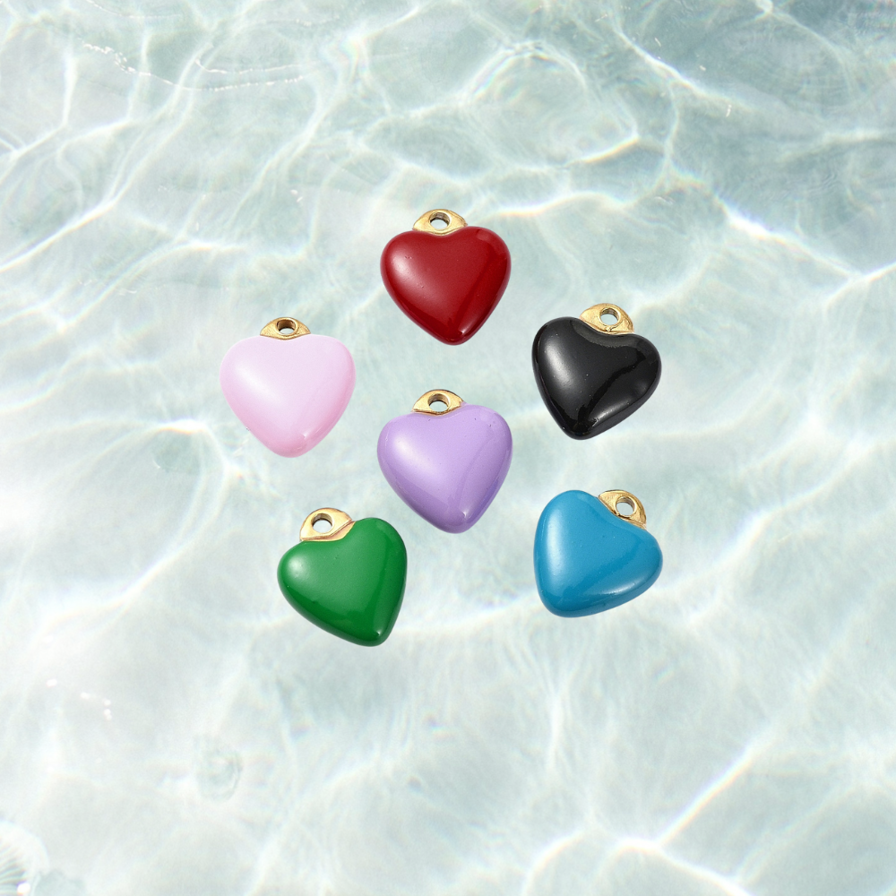 Gold colorful heart charm with assorted colors on waterproof background