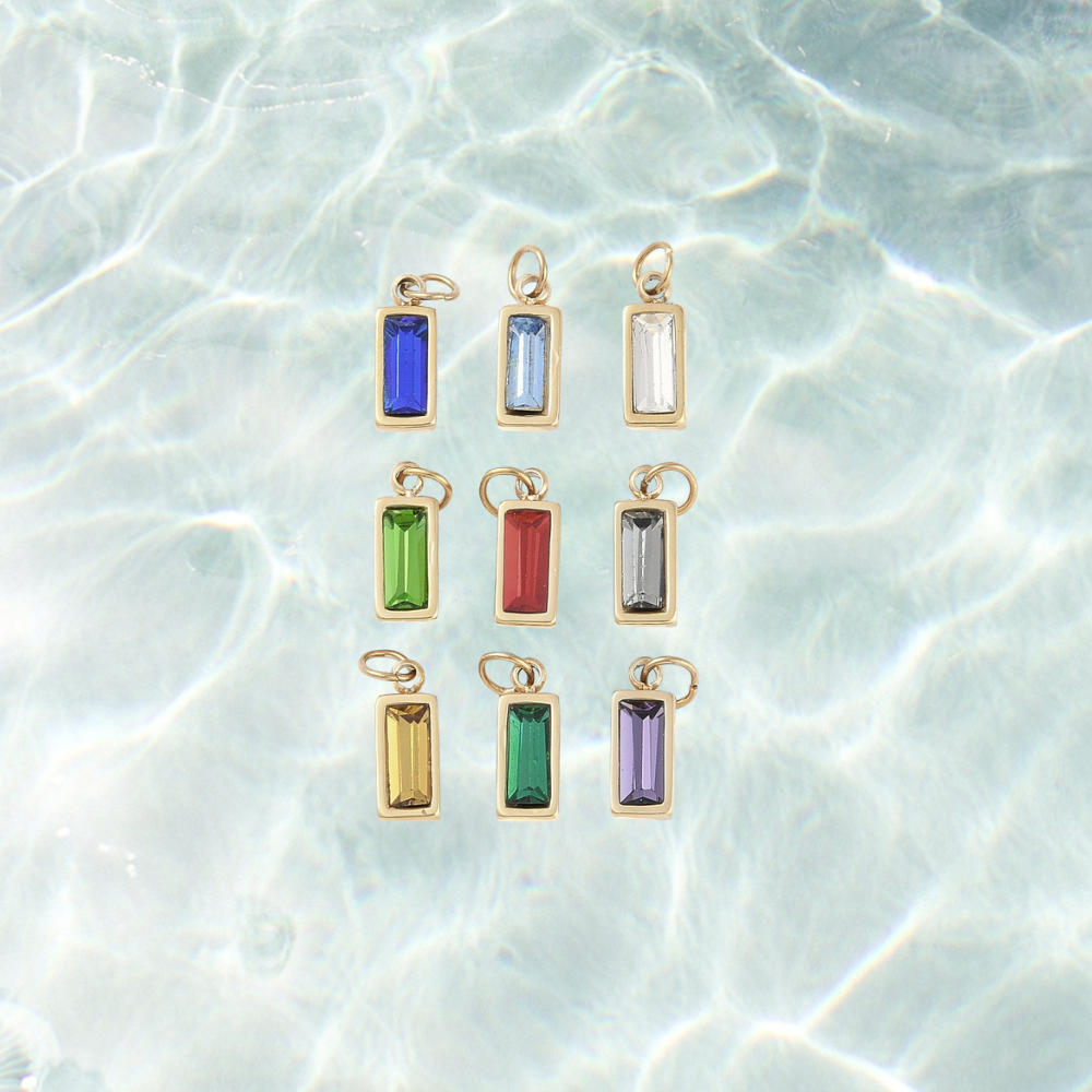 Gold jewel assorted gemstone charm on a waterproof background