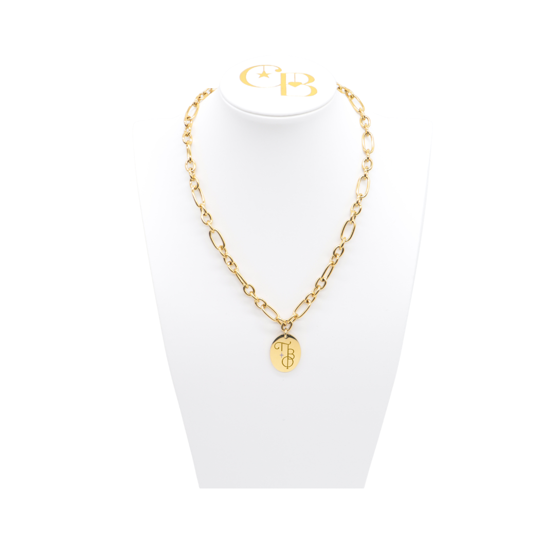 Pi Beta Phi gold large link keepsake necklace with large oval charm displayed on white necklace bust front view with new vertical/stacked greek letters