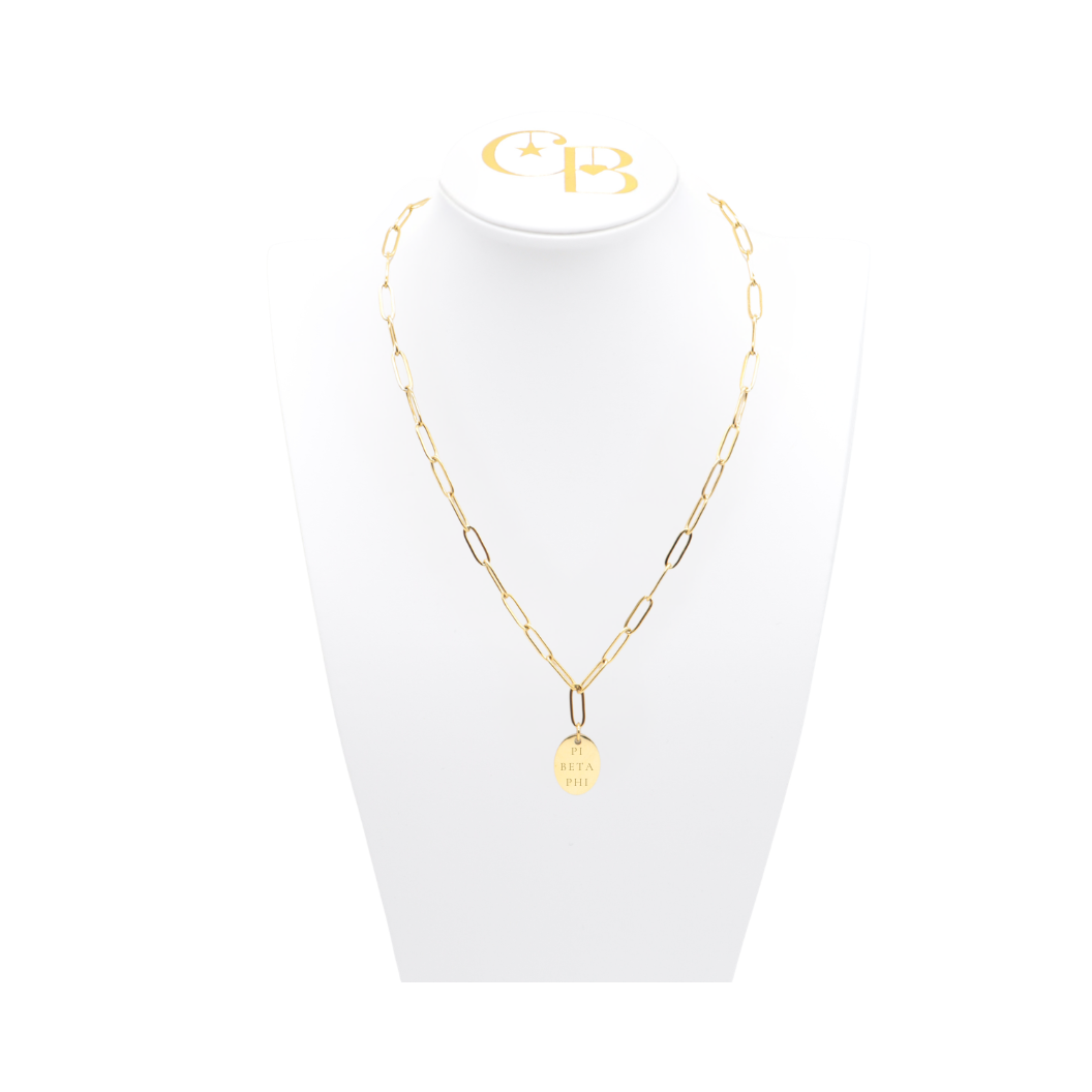 Pi Beta Phi gold link storyline necklace with small oval charm displayed on white necklace bust front view with full sorority name