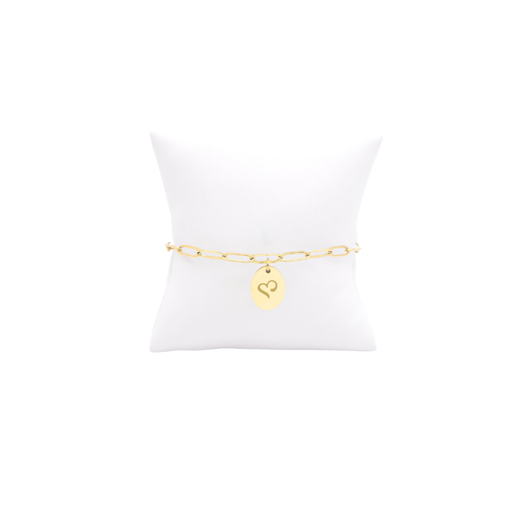 Sigma Kappa gold link storyline bracelet with small oval charm with heart icon on white pillow front view