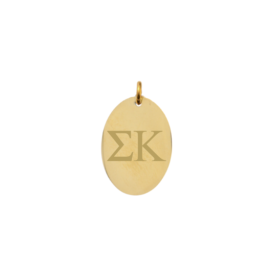 Sigma Kappa gold large oval charm with horizontal greek letters front view